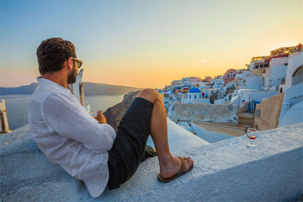 1Man-Enjoying-Wine-at-Santorini-Sunset